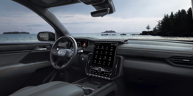 Interior view of a GMC showcasing the dashboard with the reduced engine power warning displayed.