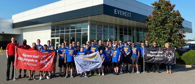 Group of special olympics participants in front of Everett Buick GMC dealership