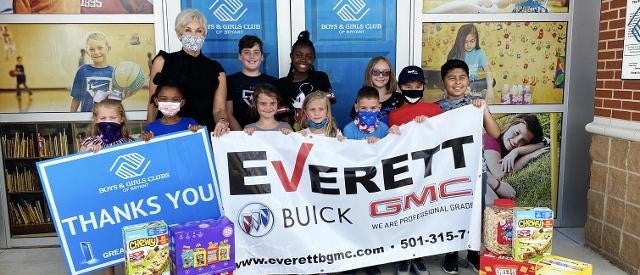 members of Boys and Girls club holding Everett sign